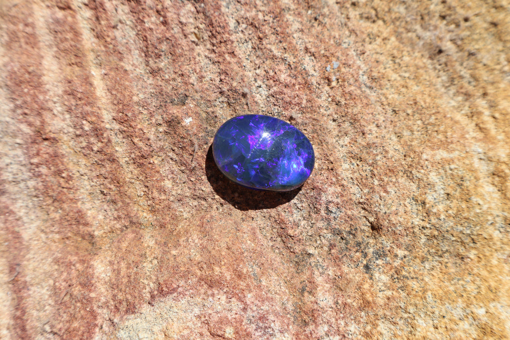 17.65ct Lightning Ridge Black Opal - Bright Purple & Aqua Flash. High dome. 22 x 16 x 8