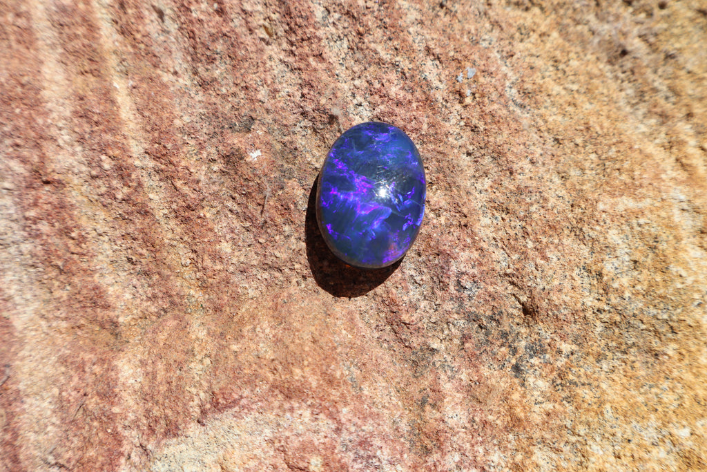 17.65ct Lightning Ridge Black Opal - Bright Purple & Aqua Flash. High dome. 22 x 16 x 8