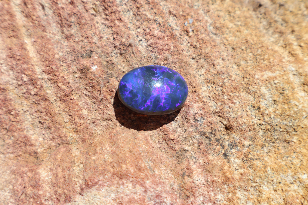 17.65ct Lightning Ridge Black Opal - Bright Purple & Aqua Flash. High dome. 22 x 16 x 8